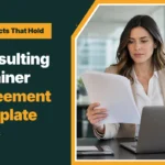 Consulting retainer agreement template, with a consultant reviewing a printed contract at her desk